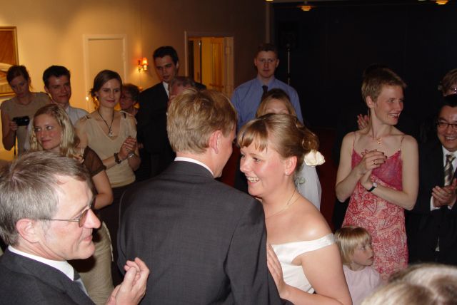 The wedding waltz is performed shortly before midnight and the crowd slowly closes in on the couple