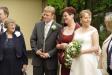The groom's mother is on the left and the bride's is in the middle